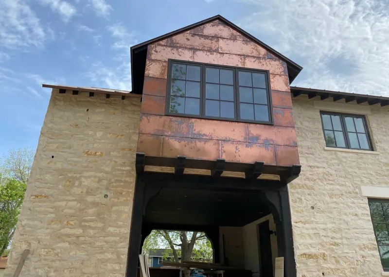 Copper metal panel facade on a stone building for Skylight Installation in San Rafael